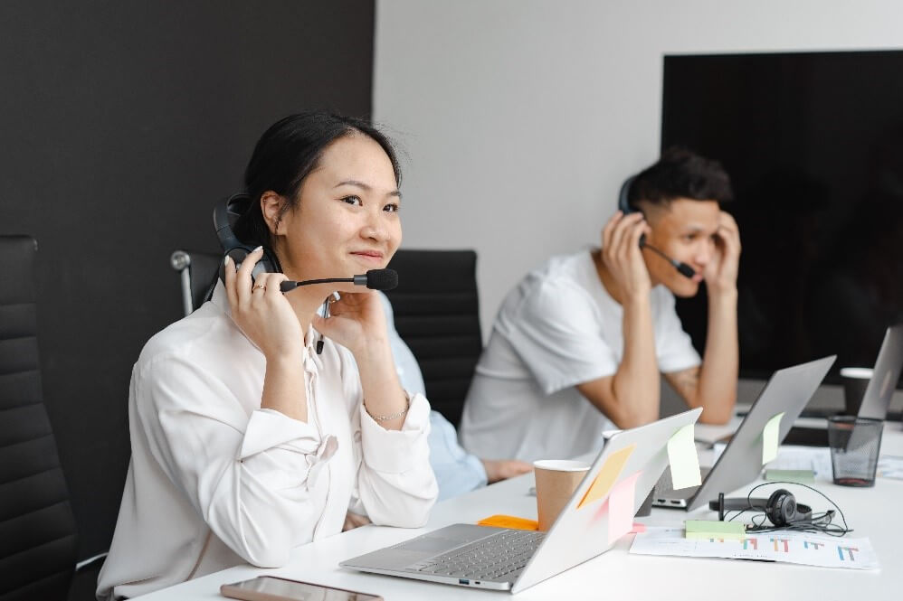 Female office worker looking admiringly at someone behind the camera