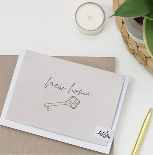New home greeting card with a key design