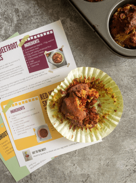 muffin recipe cards with a child's hand grabbing a muffin