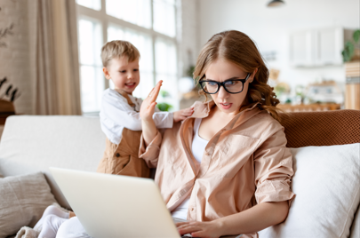 toddler annoying working mum on laptop