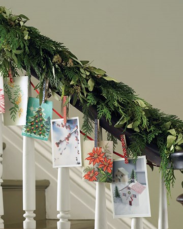 Christmas card display idea using a garland on a banister
