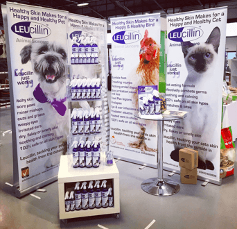 Roll up banners for pet skin care brand Leucillin at an event