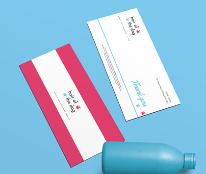 Front and back of Compliment Slips for a dog groomers