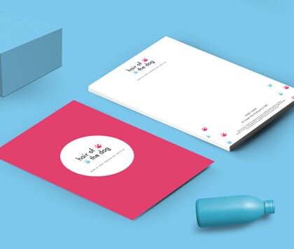 Front and back of pink Letterheads for a dog groomers