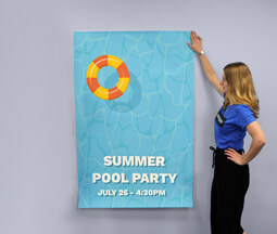 A blue 60 x 40 Poster with a rubber ring in a swimming pool