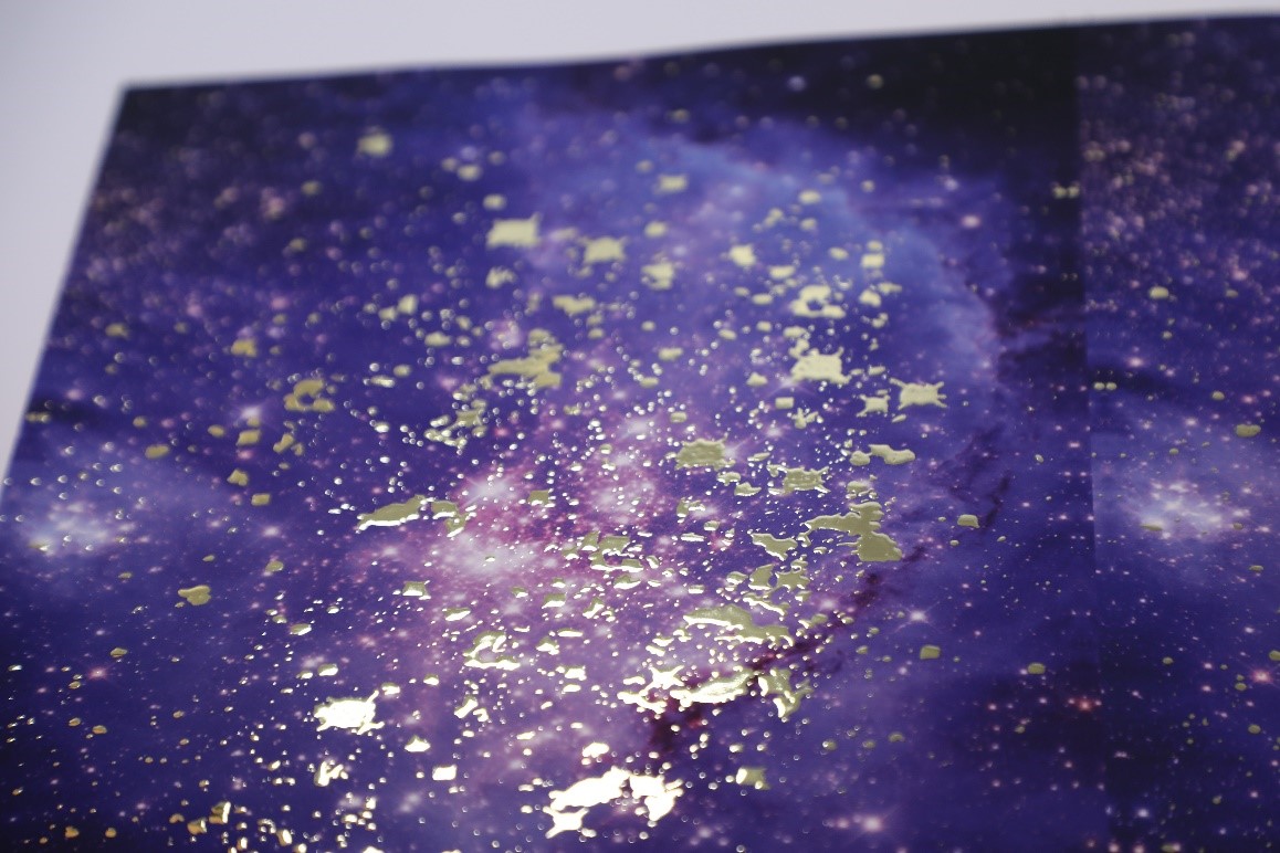 Silver foiling used to create a galaxy print effect on a poster