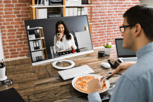 man and woman having a dinner date over a video call