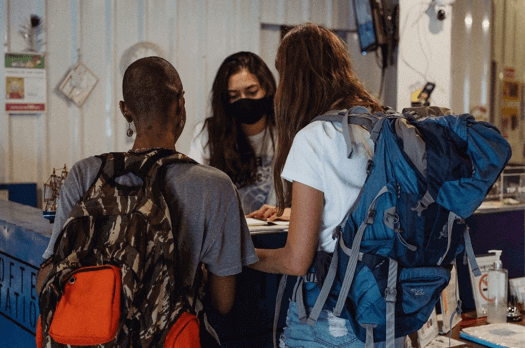 Customers wearing face masks in a cafe